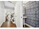 Stylish powder room with unique wallpaper, pedestal sink, and modern fixtures at 2527 W Maryland Ave # A, Tampa, FL 33629