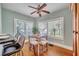 Bright breakfast nook with a rustic wooden table and four cushioned stools at 455 13Th Ne Ave, St Petersburg, FL 33701