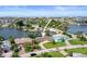 High-angle view of house on canal with neighborhood and water access at 613 79Th S Cir, St Petersburg, FL 33707