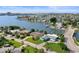 Aerial view of waterfront home with private driveway and lush landscaping at 613 79Th S Cir, St Petersburg, FL 33707