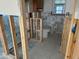 Toilet and bathroom with flood damage and walls removed at 613 79Th S Cir, St Petersburg, FL 33707