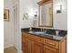 Bathroom with granite countertop and updated fixtures at 613 79Th S Cir, St Petersburg, FL 33707