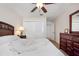 Bedroom with ceiling fan and built-in wardrobe at 613 79Th S Cir, St Petersburg, FL 33707