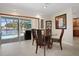 Small dining area with glass-top table and four chairs at 613 79Th S Cir, St Petersburg, FL 33707