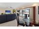 Bright dining room with glass table and view of the pool at 613 79Th S Cir, St Petersburg, FL 33707