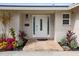 Modern front door with stylish landscaping at 613 79Th S Cir, St Petersburg, FL 33707