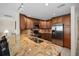 Kitchen with stainless steel appliances and wood cabinets at 613 79Th S Cir, St Petersburg, FL 33707