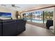 Living room with water views and sliding doors to the pool at 613 79Th S Cir, St Petersburg, FL 33707