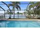 Enclosed pool and spa with water views; perfect for relaxing at 613 79Th S Cir, St Petersburg, FL 33707