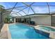 Relaxing pool and spa with covered patio at 613 79Th S Cir, St Petersburg, FL 33707