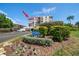 Condo building exterior showcasing a desirable waterfront location and landscaping at 6218 Palma Del Mar S Blvd # 606, St Petersburg, FL 33715