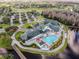 Aerial view of community clubhouse, pool, and golf course at 11609 Weaver Park Ct, Trinity, FL 34655