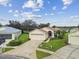 Single-story house with a two-car garage and a spacious lawn at 11609 Weaver Park Ct, Trinity, FL 34655