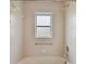 Bathroom with shower/tub combo and tile surround at 11609 Weaver Park Ct, Trinity, FL 34655