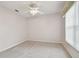 Bright bedroom with ceiling fan and carpet at 11609 Weaver Park Ct, Trinity, FL 34655