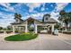 Gated community entrance with landscaping and signage at 11609 Weaver Park Ct, Trinity, FL 34655