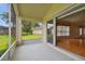 Bright screened porch overlooking backyard and green space at 11609 Weaver Park Ct, Trinity, FL 34655