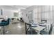 Bright dining area with white table and gray chairs, open to living area at 1334 Fairmont St, Clearwater, FL 33755