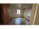 Spacious bedroom featuring wood-look floors and dual windows at 307 Tweed Ave, Seffner, FL 33584