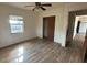 Bright bedroom with wood-look floors and ceiling fan at 307 Tweed Ave, Seffner, FL 33584