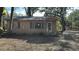 Tan single story house with mature trees at 307 Tweed Ave, Seffner, FL 33584