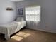 Cozy bedroom with carpet flooring and a window at 4313 Hollow Hill Dr, Tampa, FL 33624