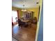 Formal dining room with wood floors and floral accents at 4313 Hollow Hill Dr, Tampa, FL 33624