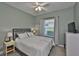 Guest bedroom with a full-size bed and TV at 806 Chipper Dr, Sun City Center, FL 33573