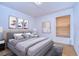 Cozy bedroom with light walls and wood floors at 10922 Brucehaven Dr, Riverview, FL 33578