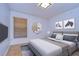 Serene bedroom featuring wood floors and modern decor at 10922 Brucehaven Dr, Riverview, FL 33578