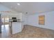 Open dining area with tile flooring and adjacent kitchen at 10922 Brucehaven Dr, Riverview, FL 33578