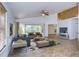 Bright living room featuring tile floors and sliding glass doors leading to the backyard at 10922 Brucehaven Dr, Riverview, FL 33578