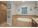 Relaxing bathroom with a large garden tub and tile shower at 9911 Golden Loop, New Port Richey, FL 34654