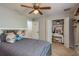 Cozy bedroom with a ceiling fan and large closet at 9911 Golden Loop, New Port Richey, FL 34654