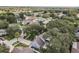 Aerial view of the neighborhood showcasing the lush landscaping and mature trees at 1429 Monte Lake Dr, Valrico, FL 33596