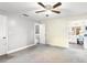 Spacious main bedroom with a ceiling fan and access to the en-suite bathroom at 1429 Monte Lake Dr, Valrico, FL 33596