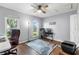 This office features hardwood flooring, a ceiling fan, and natural light from two windows at 1429 Monte Lake Dr, Valrico, FL 33596