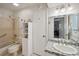 Well-lit bathroom featuring a shower/tub combination and mosaic-tiled vanity at 3157 Mission Grove Dr, Palm Harbor, FL 34684