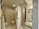 Well-lit bathroom featuring a shower/tub combination and mosaic-tiled vanity at 3157 Mission Grove Dr, Palm Harbor, FL 34684