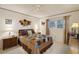 Comfortable bedroom with a ceiling fan, window and stylish décor at 3157 Mission Grove Dr, Palm Harbor, FL 34684