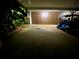 A well-lit carport providing parking and storage at 3157 Mission Grove Dr, Palm Harbor, FL 34684