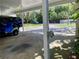 Covered parking area for residents with room for car and golf cart at 3157 Mission Grove Dr, Palm Harbor, FL 34684