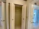 Open closet with bi-fold doors and shelving at 3157 Mission Grove Dr, Palm Harbor, FL 34684