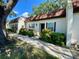 Home exterior with lush landscaping at 3157 Mission Grove Dr, Palm Harbor, FL 34684