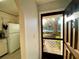 View through the front door showing the pool and the kitchen to the left at 3157 Mission Grove Dr, Palm Harbor, FL 34684