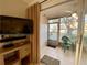 Relaxing enclosed lanai with television for entertainment and outdoor views at 3157 Mission Grove Dr, Palm Harbor, FL 34684
