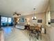 Cozy living room featuring tile floors, comfortable seating, and sliding glass doors leading to patio at 3157 Mission Grove Dr, Palm Harbor, FL 34684