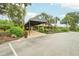 Inviting main entrance featuring manicured landscaping, a covered walkway and a welcoming ambiance at 3157 Mission Grove Dr, Palm Harbor, FL 34684