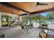 Spacious screened patio with a ceiling fan and view of the pool at 3157 Mission Grove Dr, Palm Harbor, FL 34684