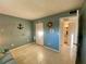 Spacious spare room with blue walls, tile flooring, nautical decor, closet and bathroom at 3157 Mission Grove Dr, Palm Harbor, FL 34684